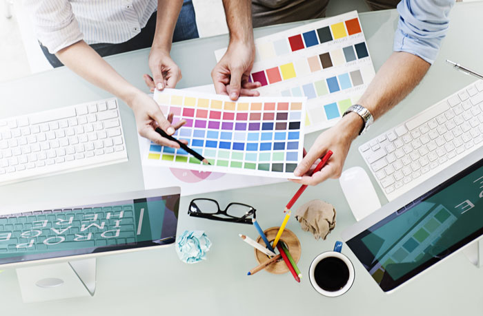 graphic design artists consulting about color schemes